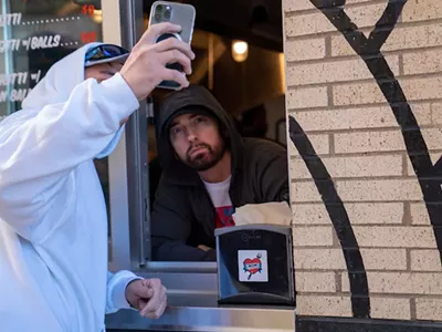 The real Slim Shady showed up to greet fans at his new Mom's Spaghetti restaurant in Detroit.