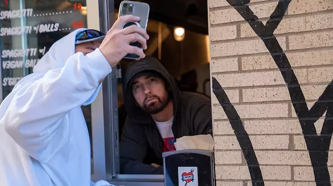 The real Slim Shady showed up to greet fans at his new Mom's Spaghetti restaurant in Detroit.