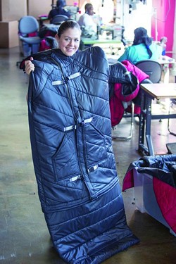 Empowerment Plan’s Veronika Scott, who founded the fashion company in 2011, models her hallmark sleeping bag coat.