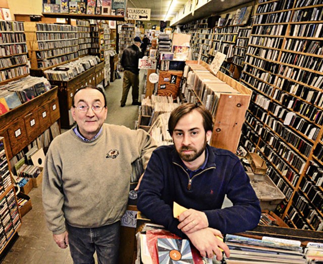 Enocore's Peter Dale with employee-musician Tadd Mullinix. - MT photo: Doug Coombe