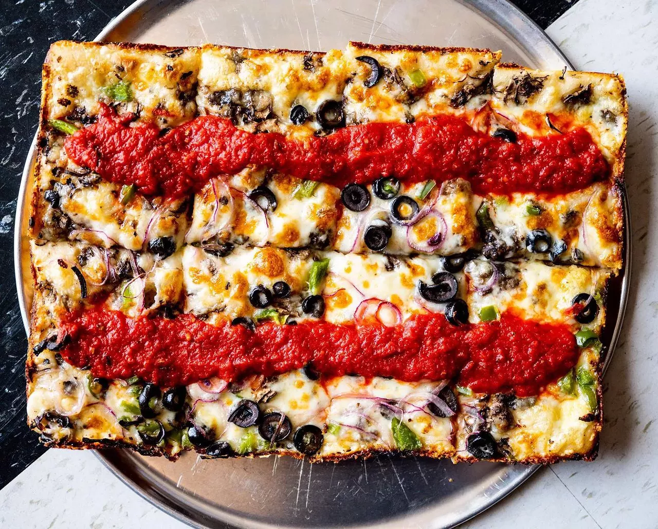 Frank’s Family Pizzeria 3144 Biddle Ave., Wyandotte; 734-282-0512; frankspizza1952.com Founded in 1952, this downriver favorite reopened in 2021 under new owners: brothers and Detroit-style pizza purveyors Brandon and Zane Hunt and Josh Cade, who also co-owns the music venue District 142. Photo via Gregg’s Pizza & Bar-B-Que / Instagram