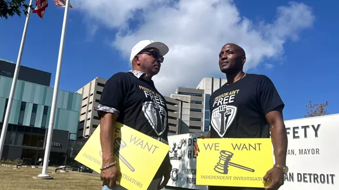 Mark Craighead (left) stands with Lamarr Monson during a rally to investigate former Detroit Detective Barbara Simon, who was involved in their wrongful convictions.