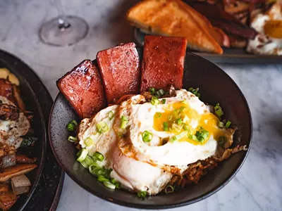 Tigerlily’s new weekend brunch menu includes a Pacific islands twist on breakfast favorites, like Eggs Benedict served over a bao bun with spam.
