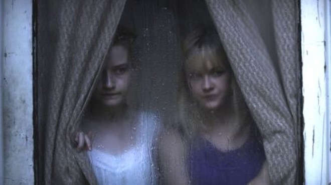 Window dressing: Julia Garner and Ambyr Childers are in for the most murderous holiday meal ever.