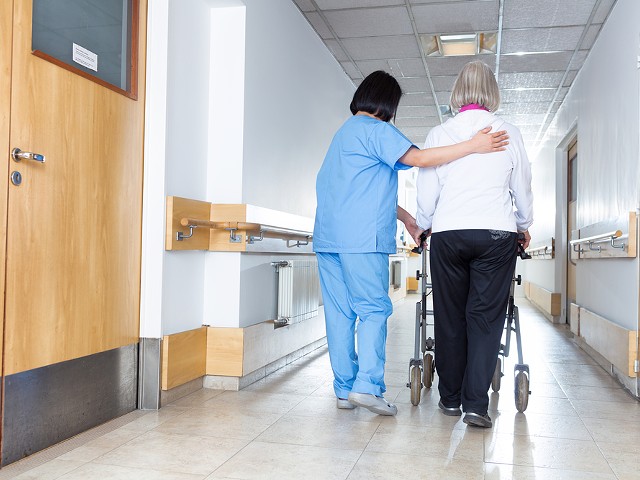 A nurse and an elderly patient.