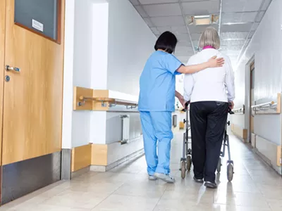 A nurse and an elderly patient.