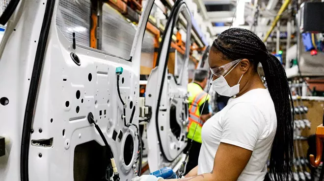 A woman working at Ford's Dearborn truck plant.