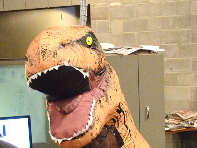 The Designosaur picks up a copy of MT in the newsroom Thursday.