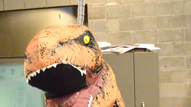 The Designosaur picks up a copy of MT in the newsroom Thursday.