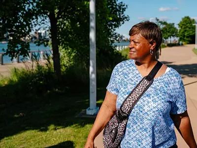 Terry Pita walking at the Detroit River.