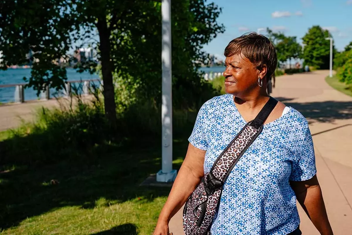 Image: Terry Pita walking at the Detroit River.