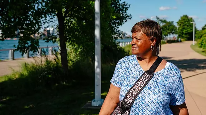 Terry Pita walking at the Detroit River.