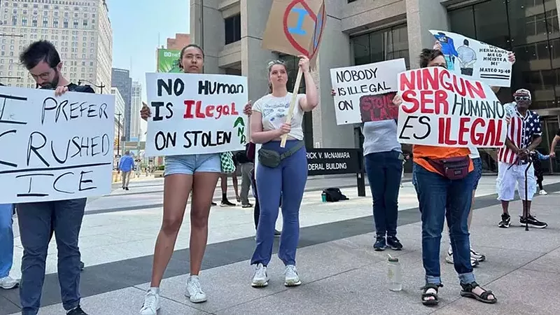 Protesters rally outside the U.S. District Court in Detroit after an undocumented immigrant was arrested.
