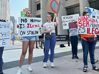 Protesters rally outside the U.S. District Court in Detroit after an undocumented immigrant was arrested.