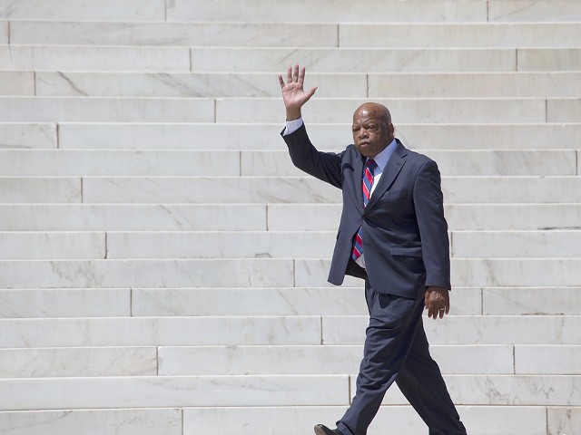 Georgia Congressman John Lewis waves at the 50th Anniversary of the march on Washington and Martin Luther King's I Have A Dream Speech in 2013.