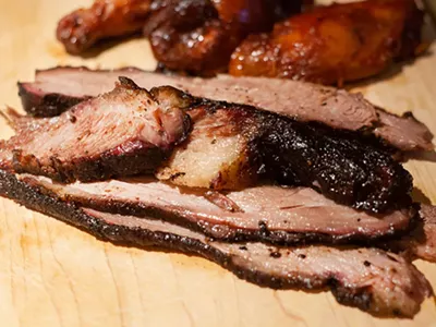 Mouth-watering brisket is priced by the pound at Royal Oak’s Holiday Market.