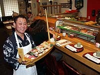 Kabuki owner K.J. Lee serves sushi for two deluxe. - Metro Times Photo / Larry Kaplan