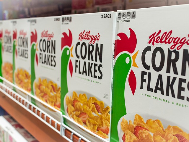 Kellog's Corn Flakes on display at an aisle in a supermarket.