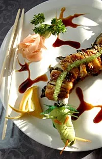 Key West roll with spicy tuna inside, BBQ eel on top and eel sauce, and wasabi tobigo shaped like a dragon from Sala Thai in Detroit. - Metro Times photo/ Rob Widdis