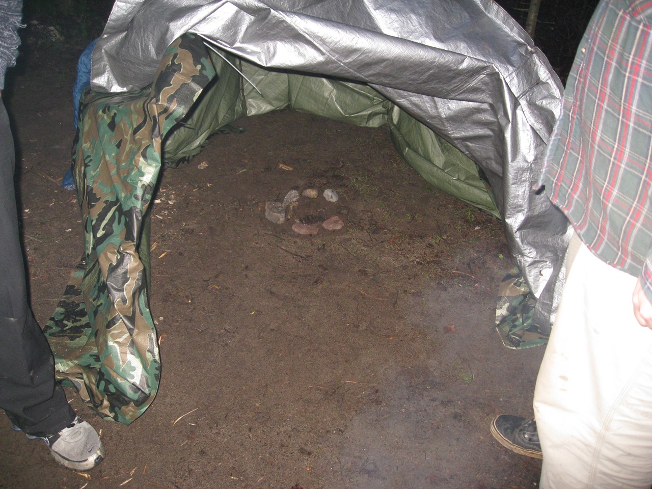 Inside the sweat lodge, a hole for hot rocks.