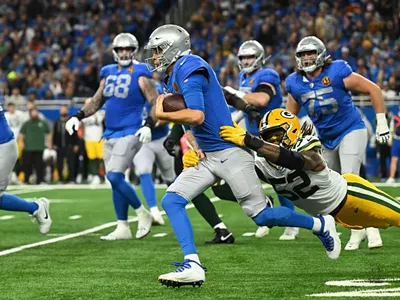 The Detroit Lions’ Jared Goff gets tackled by the Green Bay Packers’ Rashan Gary.