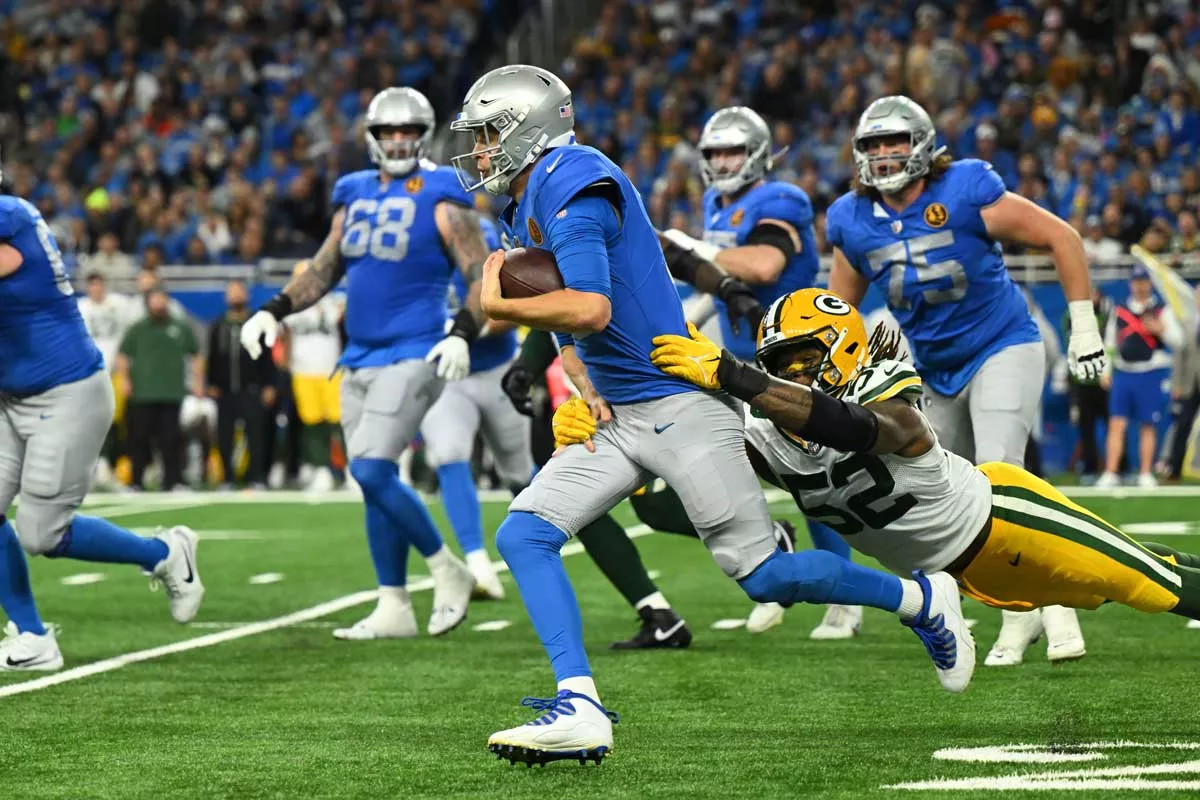 Image: The Detroit Lions’ Jared Goff gets tackled by the Green Bay Packers’ Rashan Gary.