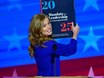 Michigan State Senator Mallory McMorrow hauls out a “Project 2025” prop at the 2024 Democratic National Convention in Chicago.