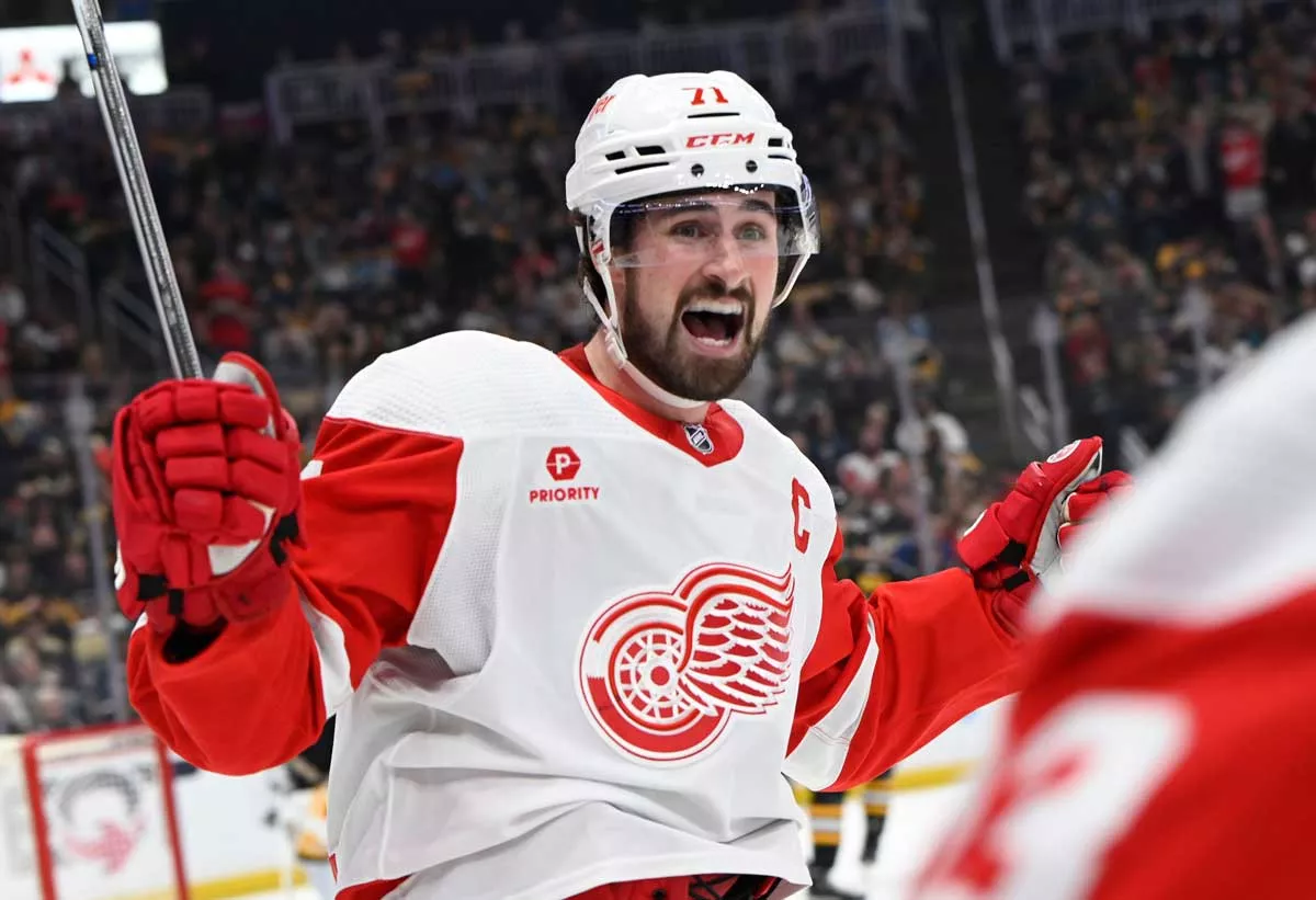 Image: Detroit Red Wings captain Dylan Larkin models the team’s new uniform, sponsored by Priority Waste Management.