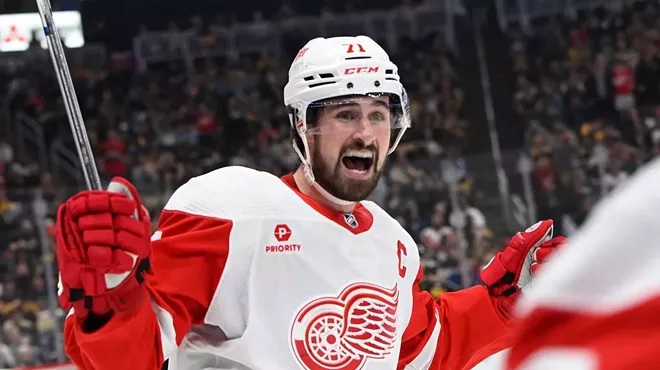 Detroit Red Wings captain Dylan Larkin models the team’s new uniform, sponsored by Priority Waste Management.