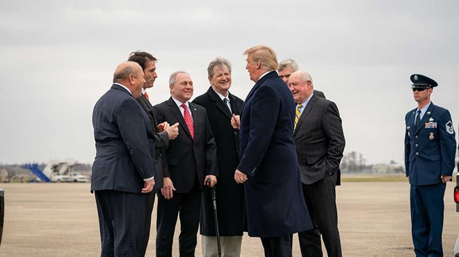 Sen. Kennedy, center, and other Republicans greeting President Trump in 2019.