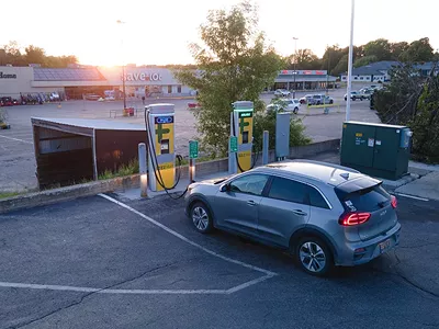 An electric car charging at a ChargePoint DC fast charger in Clare, Michigan.