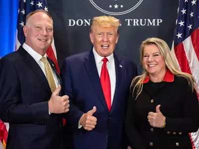 Matt Maddock, left, and Meshawn Medock, right, meet President Donald Trump.