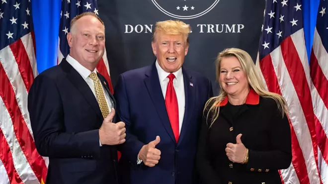 Matt Maddock, left, and Meshawn Medock, right, meet President Donald Trump.