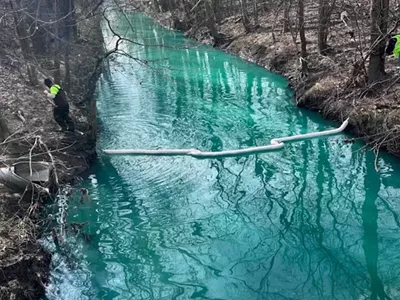 Pollution caused Bear Creek in Warren to turn fluorescent blue in 2024.