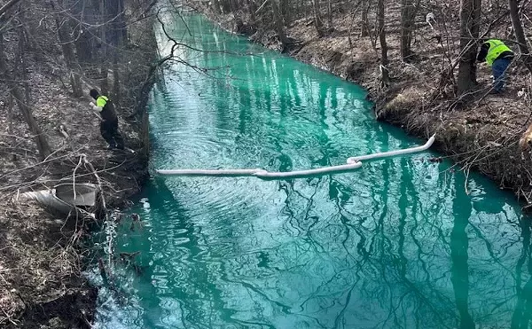 Pollution caused Bear Creek in Warren to turn fluorescent blue in 2024.