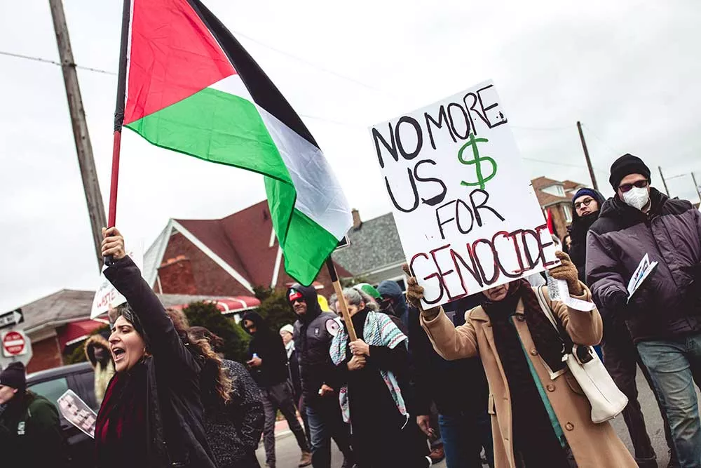 Protesters show support for the people of Palestine at a Detroit-area rally.