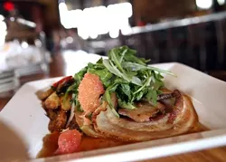 Mary’s Porchetta Hotplate, boneless Berkshire pork roast served with wild arugula, fennel salad and Tuscan potatoes, from Ottava Via in Corktown. - Robert Widdis