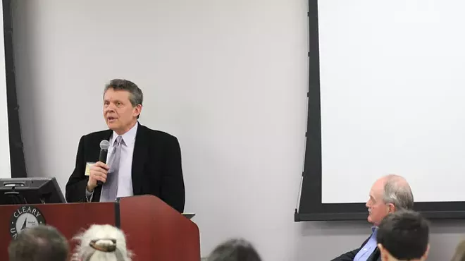 Rich Robinson, Executive Director of the Michigan Campaign Finance Network speaks at the Michigan Election Reform Conference at Cleary University in Ann Arbor last week.