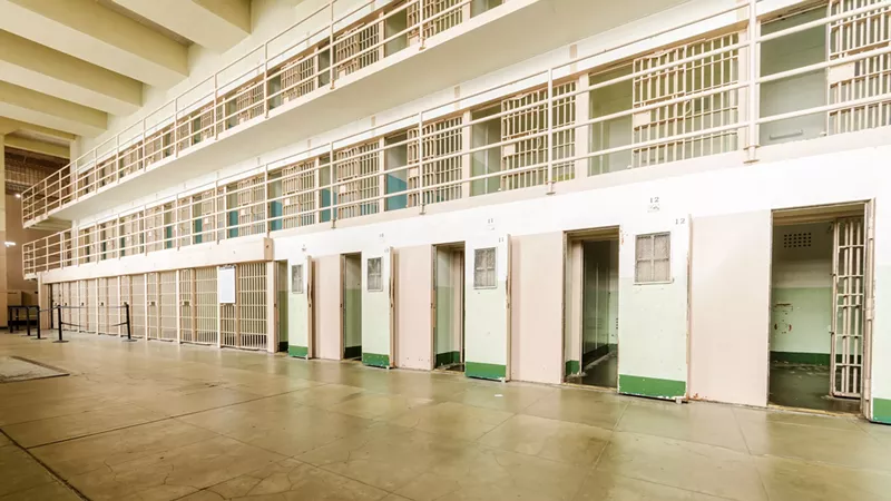 A former employee of the Michigan Department of Corrections has sued the agency and its spokesman for alleged retaliation, sexual abuse.
