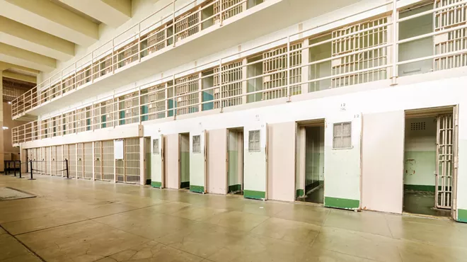 A former employee of the Michigan Department of Corrections has sued the agency and its spokesman for alleged retaliation, sexual abuse.
