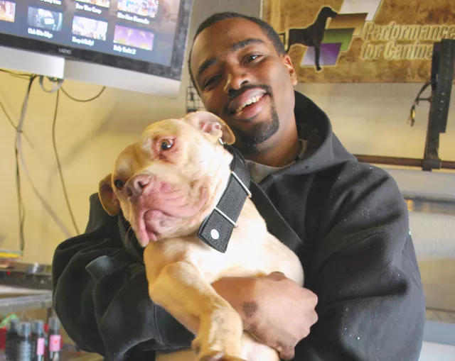 Michael Hodges with his champion pit bull Pow. - Photo: Detroitblogger John