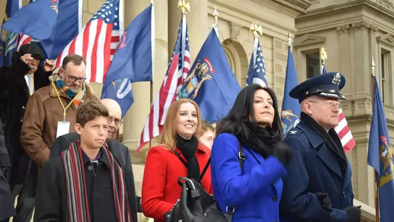 Col. Kevin Bohnsack, state air surgeon, Michigan Air National Guard, escorts Michigan Attorney General-elect Dana Nessel to the Capitol dais at the inauguration of Gov. Gretchen Whitmer, Lansing, Mich., Jan. 1, 2019.