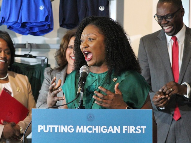 Sen. Sarah Anthony speaks at the signing of the CROWN Act at Moneyball Sportswear in Lansing, Michigan on June 15, 2023.