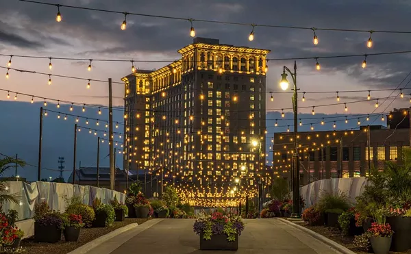 Detroit’s long-abandoned Michigan Central lit up.