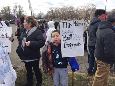 A little boy protests the Trump administration’s immigration agenda in southwest Detroit on “'A Day Without Immigrants.”