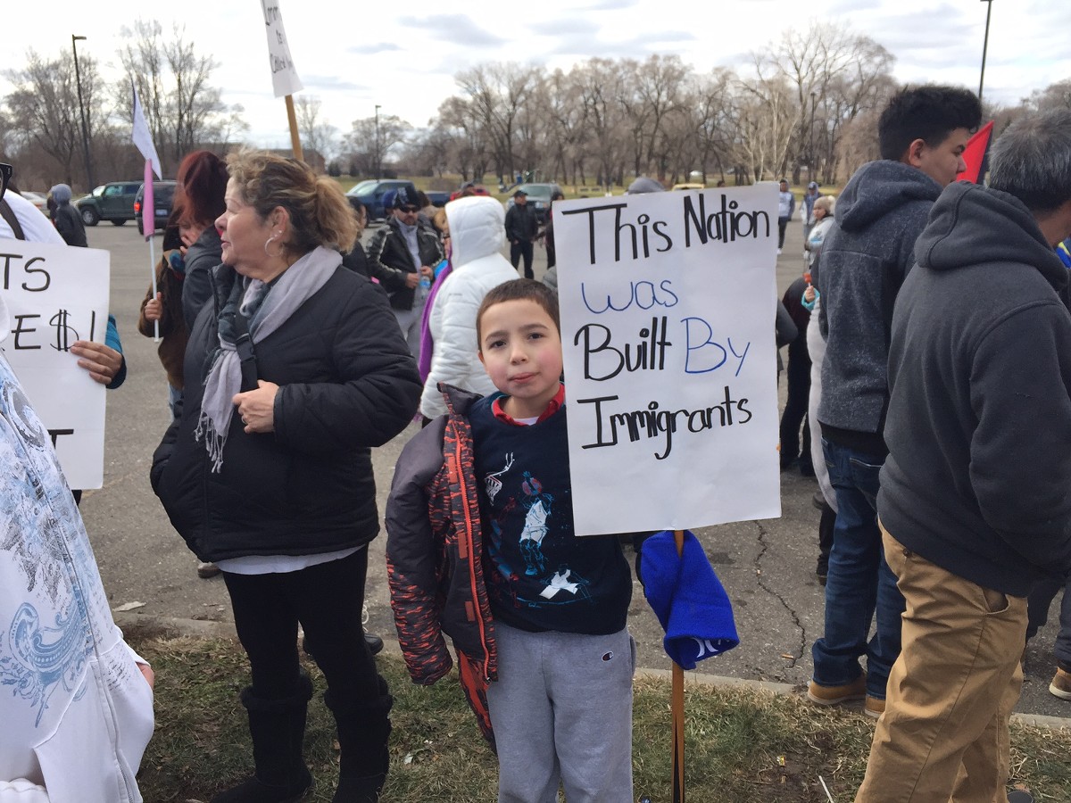 A little boy protests the Trump administration’s immigration agenda in southwest Detroit on “'A Day Without Immigrants.”