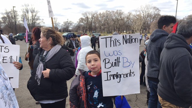 A little boy protests the Trump administration’s immigration agenda in southwest Detroit on “'A Day Without Immigrants.”