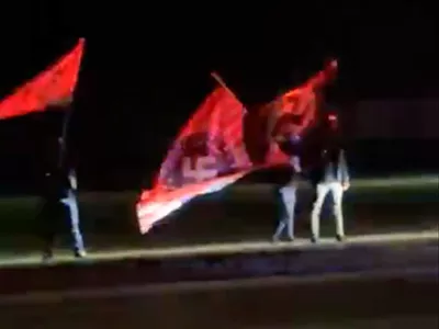 Image: Neo-Nazis gather outside Anne Frank play in Howell, waving Swastika flags