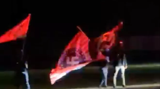 Image: Neo-Nazis gather outside Anne Frank play in Howell, waving Swastika flags