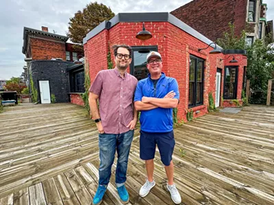 Business partners Sandy Levine (left) and Doug Hewitt (right) on the patio of their forthcoming Midtown bar, Dirty Shake.